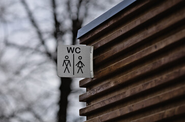 Sign of a public water closet or flush toilet