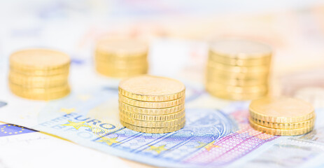 Euro currency background. Coins on top of banknotes, finance concept 