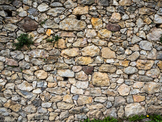 imagen textura pared de piedra con piedras de distintos tamaños y colores