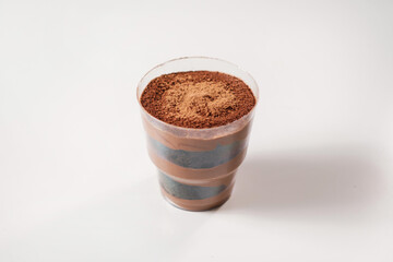 sweet dessert with cacao in a disposable bowl. food delivery