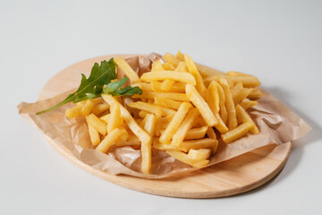 french fries on a wooden plate
