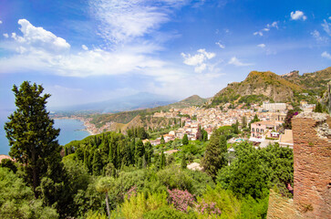 Fototapeta premium Taormina (Sicilia, Italy) - A historical center view of the touristic city in province of Messina, Sicily island, during the summer, famous for Isola Bella beach and the old theatre