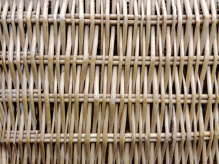 Wicker fence made of dry straw for the whole background close-up