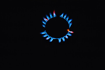 Burning blue methane gas in the form of fire on the stove.