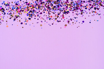 Abstract purple background with multicoloured confetti for your projects. Pink backdrop with copy...