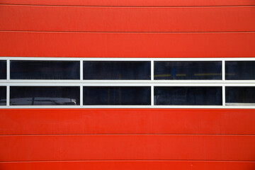Red garage door with glazed window