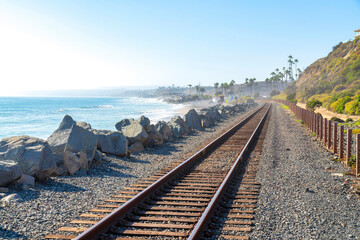 Fototapeta na wymiar Train track in San Clemente, California with a view of the beach and slope on the side