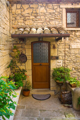 Fototapeta na wymiar Entrance door of historical building in Old Town of San Marino