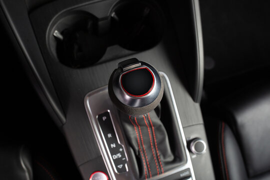 Modern car gearbox shifter handle close up
