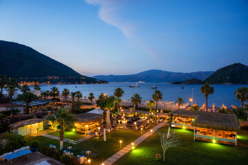 Icmeler coastline with a promenade and luxury hotels in Marmaris at twilight, Turkey  - 499998205