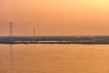 Naklejka na ściany i meble Sunset on the Amur river embankment in Khabarovsk, Russia.
