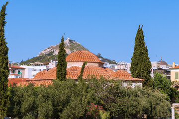 Fototapeta na wymiar Domes of orthodox cathedral under Acropolis of Athens, Greece