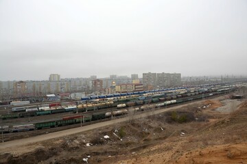 Railway tracks of the Zhiguli Sea station on the background of buildings of the Tolyatti city district