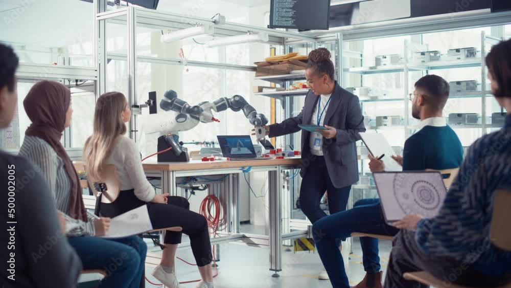 Poster Black Professional Engineer Talk with Future Developers and Explains How to Efficiently Building Machines that Replicate Human Actions, Uses Tablet to Illustrate Working Methods
