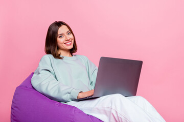 Profile side photo of young girl use laptop agent manager project workshop isolated over pink color...