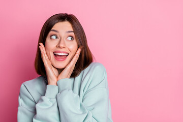 Photo of impressed young lady look promo wear blue shirt isolated on pink color background