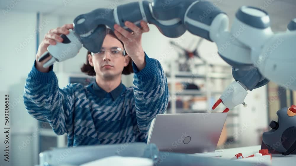 Poster Male Developer Programming Robot Arm at Laptop. Robotics Engineers Create Designs with Help of 3D CAD. Breakthrough Projects and Computer Science Education Concept