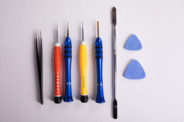Mobile phone repair tools on a white background