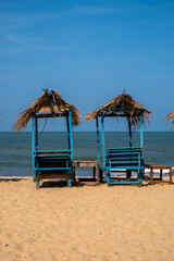 two sun loungers on the sandy beach