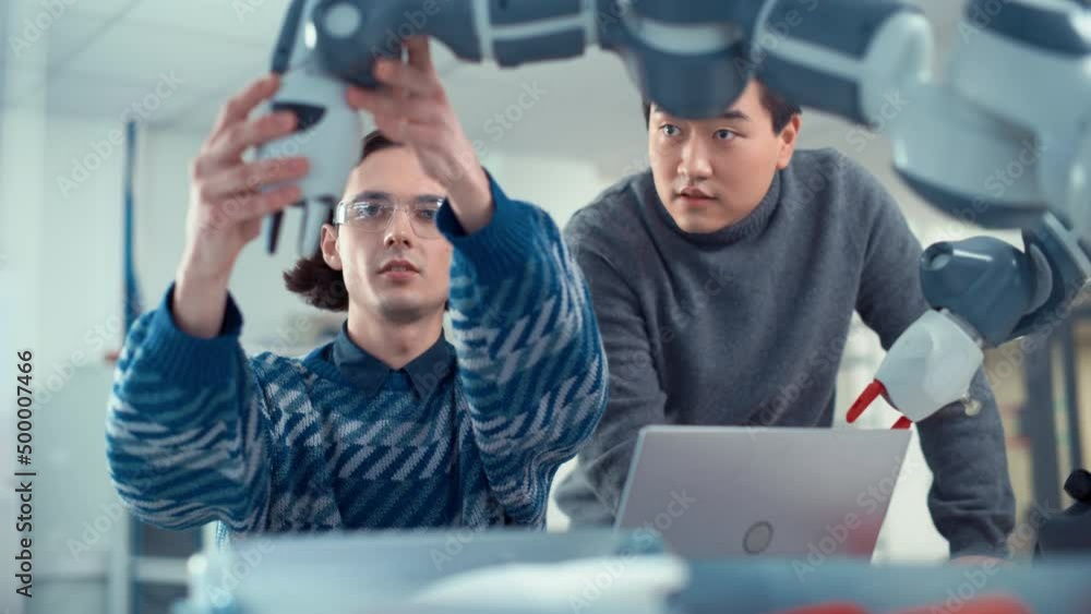Poster professional asian young engineer look at screen and tell his ideas to his colleague use laptop comp