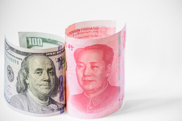 US dollar and China Yuan banknote stand up on white background