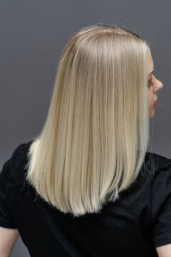 Straight hair after bleaching process. Look from behind. Hair care concept