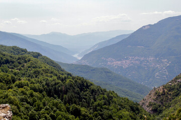 Views of Macedonia north. The path is surrounded by mountains sharing a big River, Countryside. 

