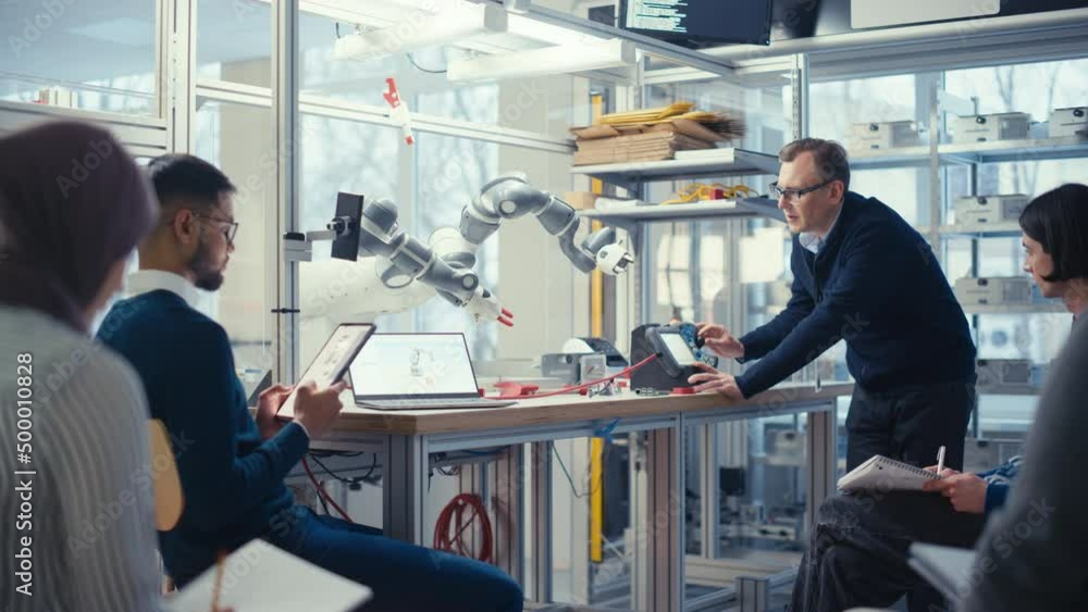 Aufkleber Diverse Computer Specialists Listen and Write while Senior Engineer Change Position of Robot Arm with Controller. Intellectual Educational Environment Concept