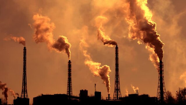 Environmental pollution by carcinogens of smoke from industrial pipes. Smoke from a factory chimney rises into the atmosphere.