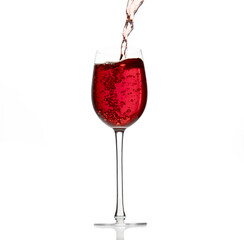 red wine pouring in a transparent glass with reflection isolated over white background