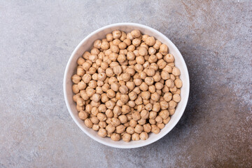 Uncooked chickpeas in white bowl