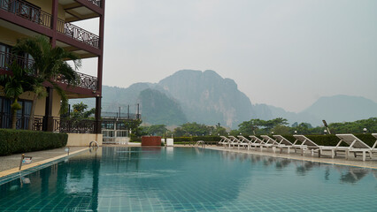 Fototapeta na wymiar Beautiful View of the Pool and the Mountain Background