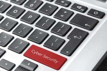 Red button with phrase Cyber Security on keyboard, closeup view