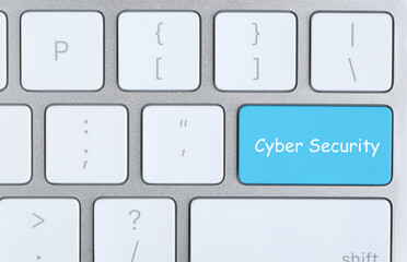 Turquoise button with phrase Cyber Security on keyboard, top view