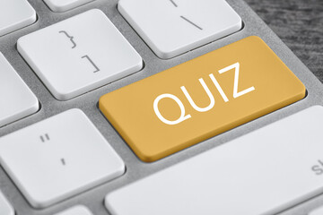 Yellow button with word QUIZ on computer keyboard, closeup view