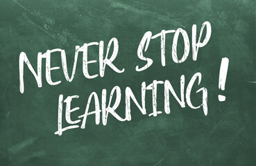 Never stop learning text written on chalkboard, message