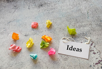 New idea concept with crumpled colorful sticky notes  and question marks 