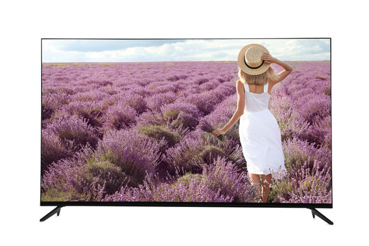 Modern wide screen TV monitor showing woman with bouquet in lavender field isolated on white