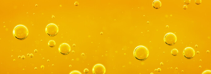 Golden liquid with air or oxygen bubbles on oil background  for projects, oil, honey, beer, juice, shampoos. Oil background. - 500017609