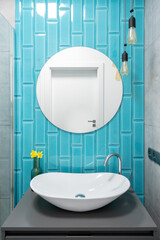 White sink in colorful bathroom after renovation