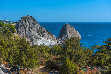 Rock Diva on beach, beautiful black sea shore landscape with mountain cliff, main nature landmark...