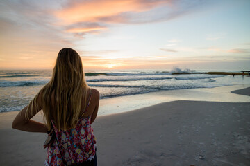 woman on the beach at sunset