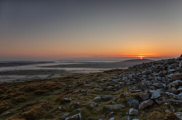 The Preseli Mountains in Pembrokeshire, Wales from Foel Drygarn at sunrise with low cloud
