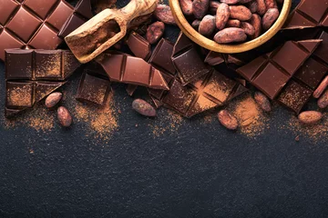 Foto auf Alu-Dibond Chocolate . Composition of cocoa powder, grated and bean cocoa bars and pieces of different milk and dark chocolate on black background. Baking Chocolate Texture. Top view with copy space. Mock up. © kasia2003