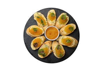 Bruschetta with pike caviar, on a black plate, isolate on white