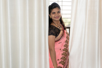 Fototapeta premium Happy young beautiful Indian woman in saree.