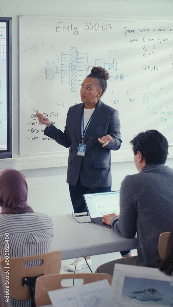 Poster Black Teacher Tell to Students and Point at Whiteboard at University Lecture Class. Diverse Group of Young Developers Listen at Seminar. Education Concept. Vertical View