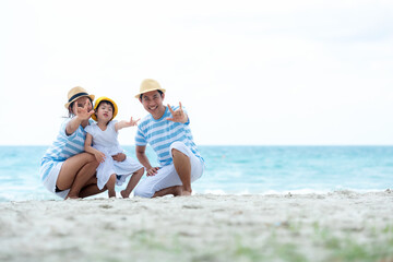 Happy family summer sea beach vacation. Asia youngÂ people lifestyle travel enjoy fun and relax leisure destination in holiday. Travel and Family Concept