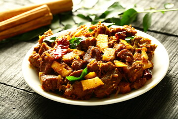 Plate of delicious meat fry,  ulath erachi, irachi, from Kerala cuisine. fried beef, mutton, 