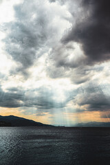 Clouds and rays on the sea